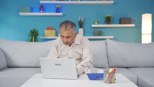 Home office worker man completes his work and relax.