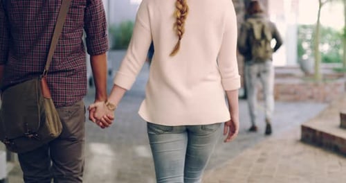 4k footage of two college students walking hand in hand