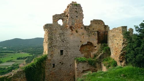 Ruined castle in Europe aerial footage cinematic medieval era Close-up of a destroyed brick wall pa