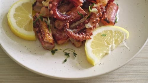 Grilled Octopus Garnished with Lemon