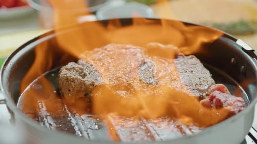 Flambeing Beef Steak in Grill Pan