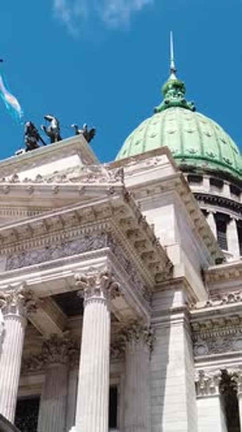 Vertical of National Congress of Argentina with Waving Flag and Sculptures in Daylight