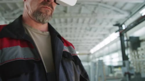 Technician Using Digital Tablet and VR Headset at Industrial Plant