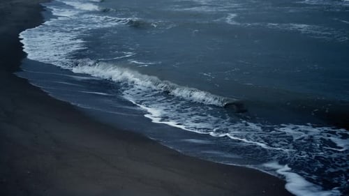 Water Waves Splashing Coast on Dark Natural Environment. Blue Sea Storming Sandy