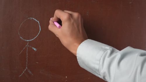 Drawing a Stick Figure Family on Brown Surface