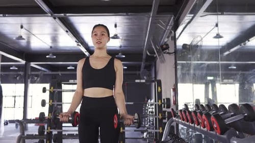 Sporty Asian Woman Exercise Training Building Muscles and Burning Fat Cardio