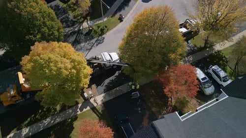 Wide Aerial Above Shot of Street Pavement Machinery in Suburban Region