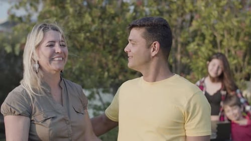 Affectionate Couple Smiling and Embracing Outdoors