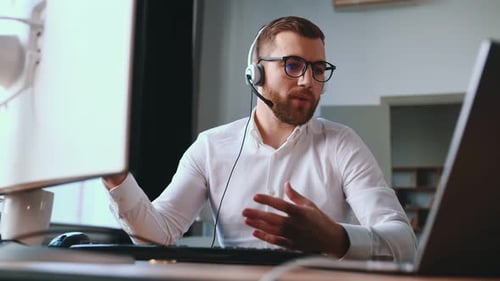 Young Man Talking on a Video Conference Call