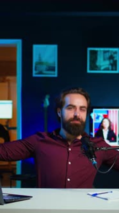 Vertical Video Energetic Influencer Using Microphone to Shoot Video Doing Frantic Gesturing