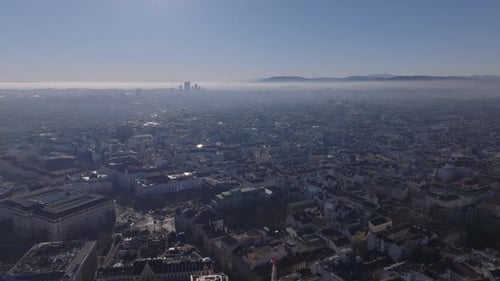 Fly Above Residential Urban Neighborhoods in Metropolis Aerial Cityscape Against Morning Sunshine