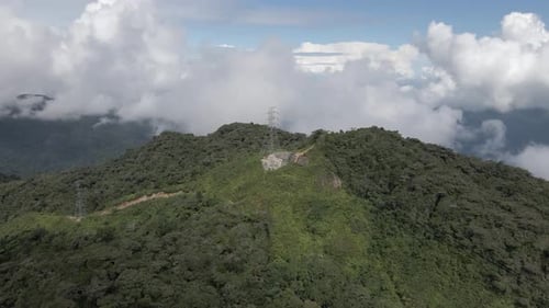 Tropical mountain flyover of high voltage transmission lines, Malaysia