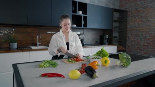 Woman Cutting Vegetables then Dancing in Kitchen