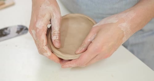 Woman Forming Clay Pot Shape By Hands Closeup in Artistic Studio