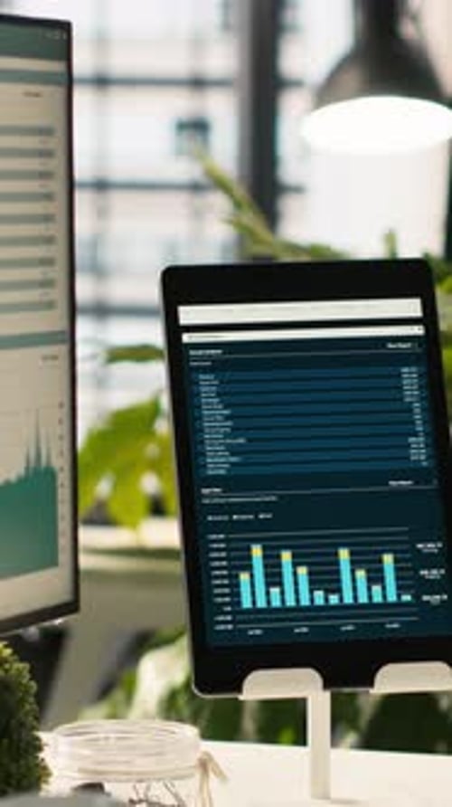 Vertical Video Modern Workspace with Key Performance Indicators Data on Display