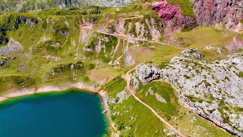 Amazing turquoise lake at the foot of the mountains