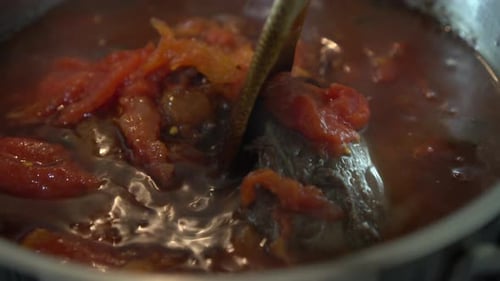 Stewing beef and vegetables. Traditional meat stew with tomato and vegetables.