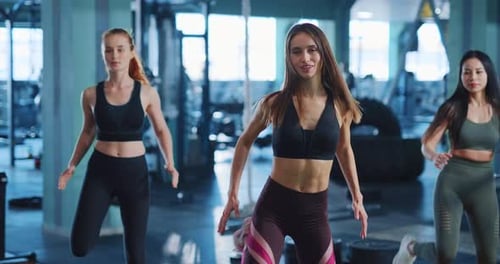 Girls at Workout Caucasian Attractive Sportive Multiethnic Women Doing Fitness Pilates Exercises
