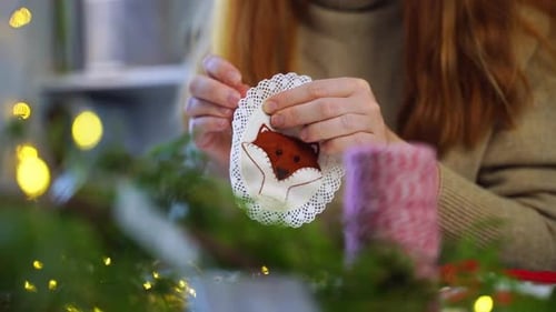 Woman Sews Christmas Ornament at Home