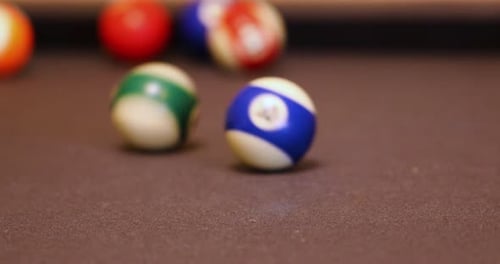 Billiard Balls Hitting And Rolling On The Pool Table. Playing Eight-ball Billiards. close up, select