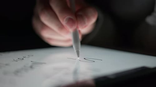 Hand Writes SELL on a Tablet with Stylus