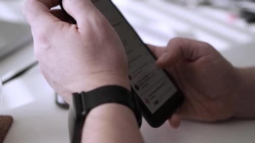 Man scrolling social media in smartphone