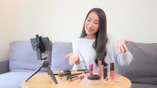 Woman Vlogging About Makeup and Cosmetics at Home
