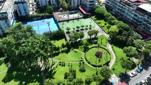 4K surround wide shot ariel view : : flower bed plants park modern lanscape design famous landmark