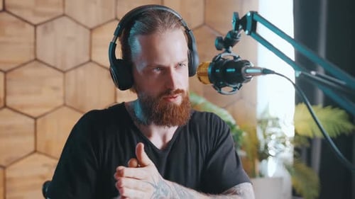 Man with Beard Recording Podcast at Home
