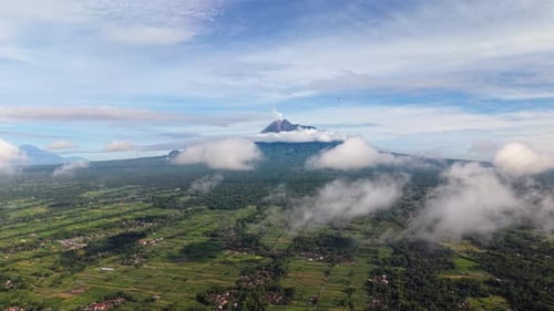 Aerial view of Mount Merapi surrounded by clouds, Indonesia.