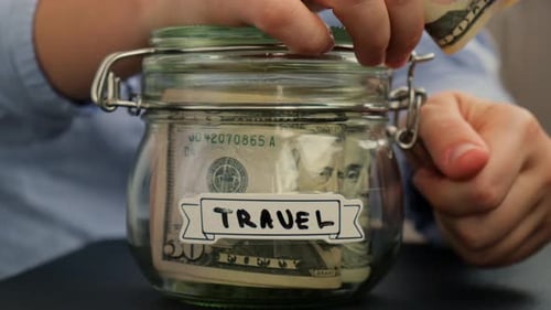 Saving Money for Travel in Glass Jar