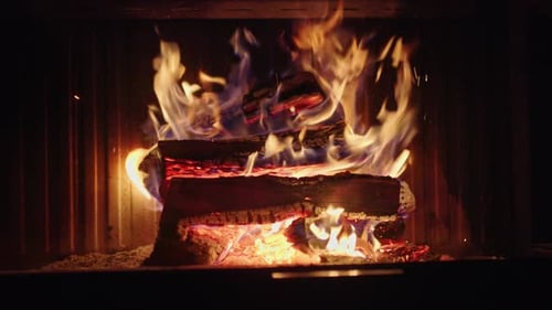 Burning Logs in Cozy Fireplace at Night