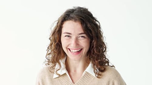 Young Happy Woman Laughing Standing at White Background Portrait