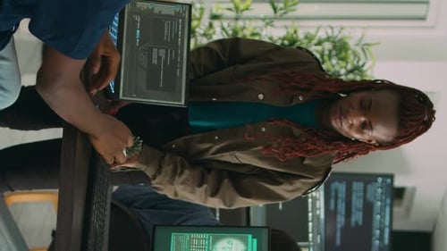 Diverse Computer Engineers Collaborating in Modern Office