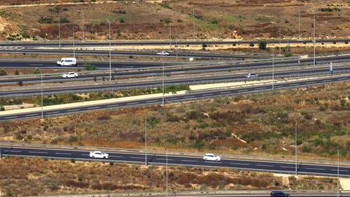 Highway traffic on multiple highways roads with traffic on all roads, Aerial footage