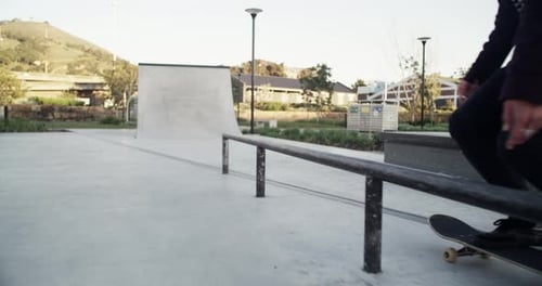 4k video footage of an unrecognizable young man out skating at a skatepark