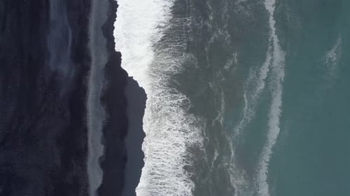 Aerial top-down view of reynisfjara black sand beach in Iceland