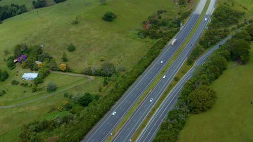 M1 Pacific Motorway - Vehicles Driving On Carriageway Passing By Lush Green Fields In Byron Bay, Que
