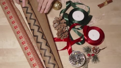 Gift Wrapping Supplies Laid Out on Wooden Surface