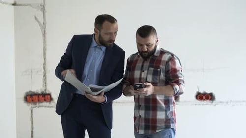 Real Estate Agent and Client Home Review