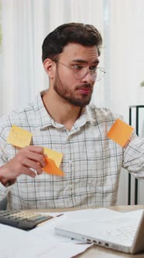 Indian Businessman Work on Laptop Sticky Notes with Many Tasks Inscription Overworked at Office