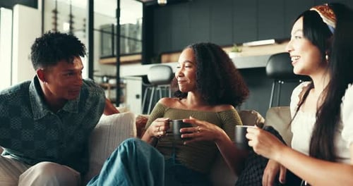 Young Adults Relaxing Together on Comfortable Couch