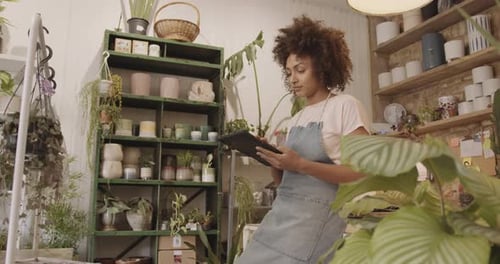 Small business entrepreneur afro American female Store Owner having a coffee break