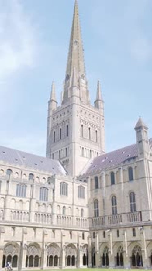 Tall spire of medieval architecture, Norwich cathedral VERTICAL