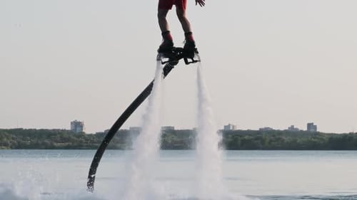 Flyboarding in Slow Motion Jet of Water Propels a Person Above the Water