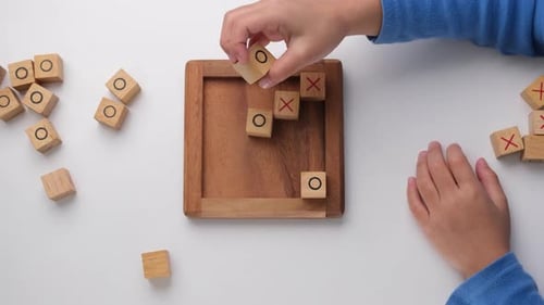 Children Playing Tic-Tac-Toe Game Indoors