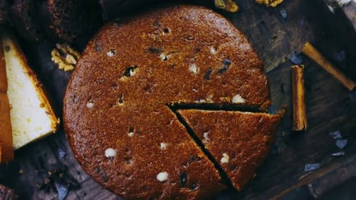 Different Kinds of Cakes Arranged on a Wooden Tray