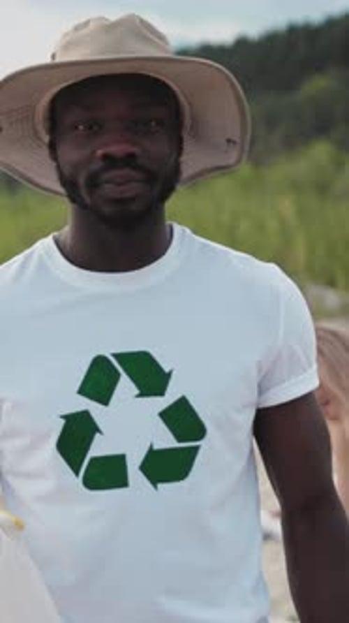 Man Smiles Wearing Recycling T-Shirt Outdoors