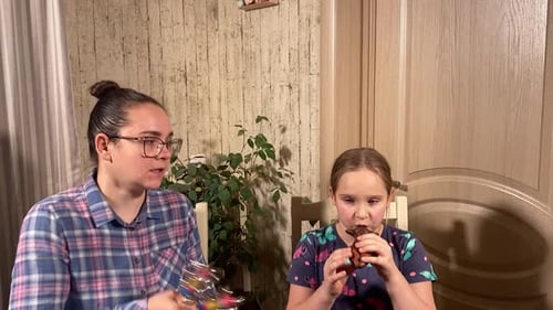 Woman and Child Play Musical Instruments