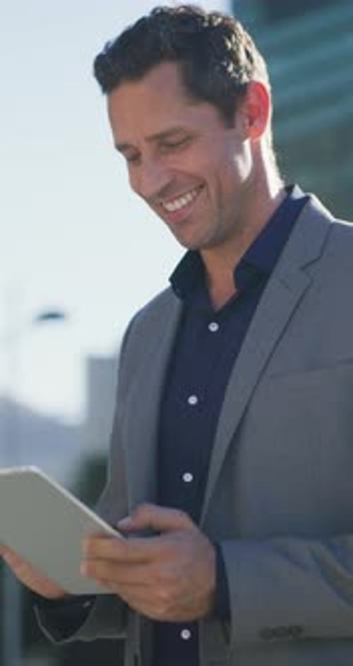 Business, laughing and tablet with man in city for break, communication or travel to work